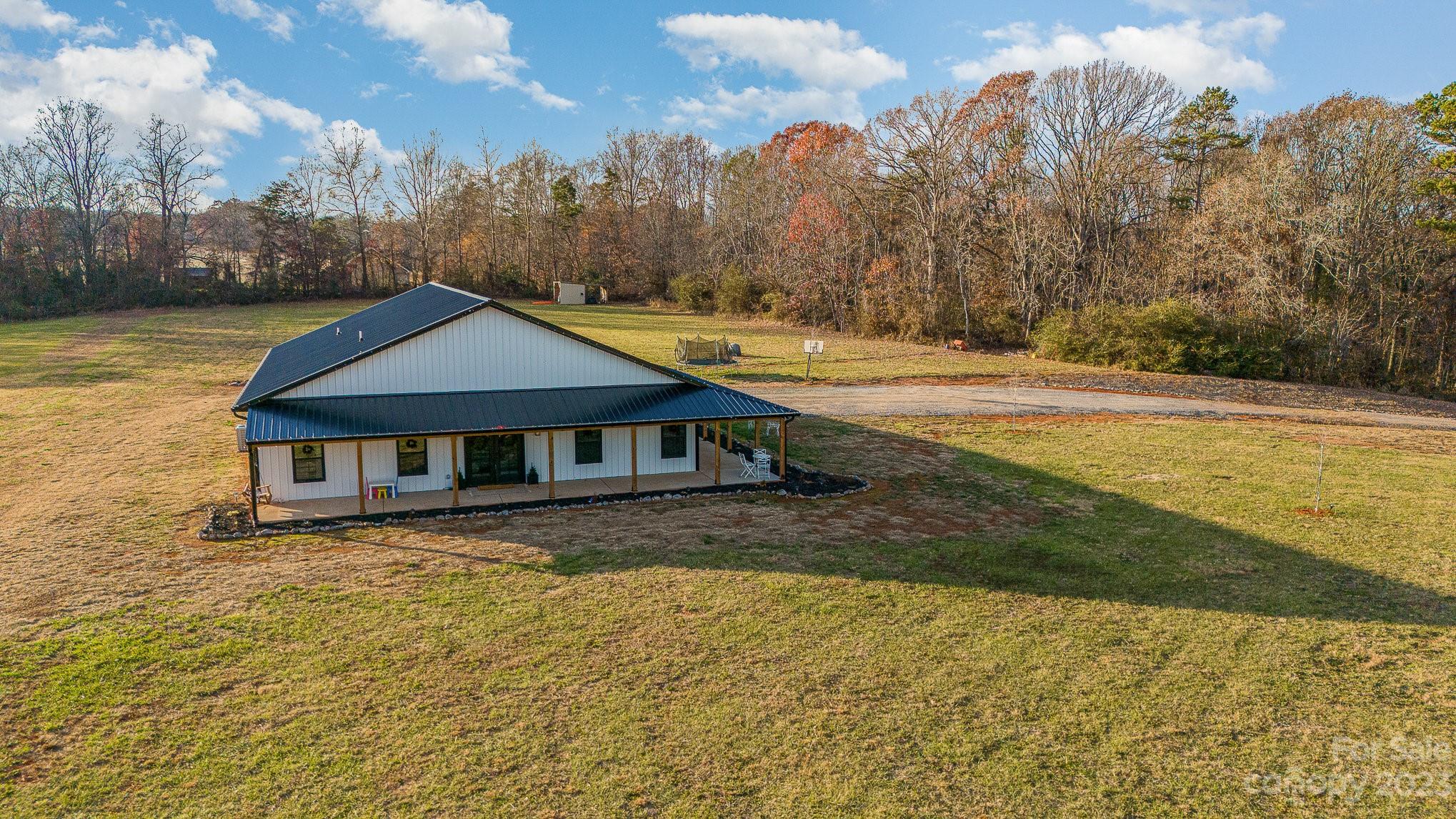 5261 Henderson Road Hamptonville, NC 27020 - Photo 8 of 46 a view of a house with a yard