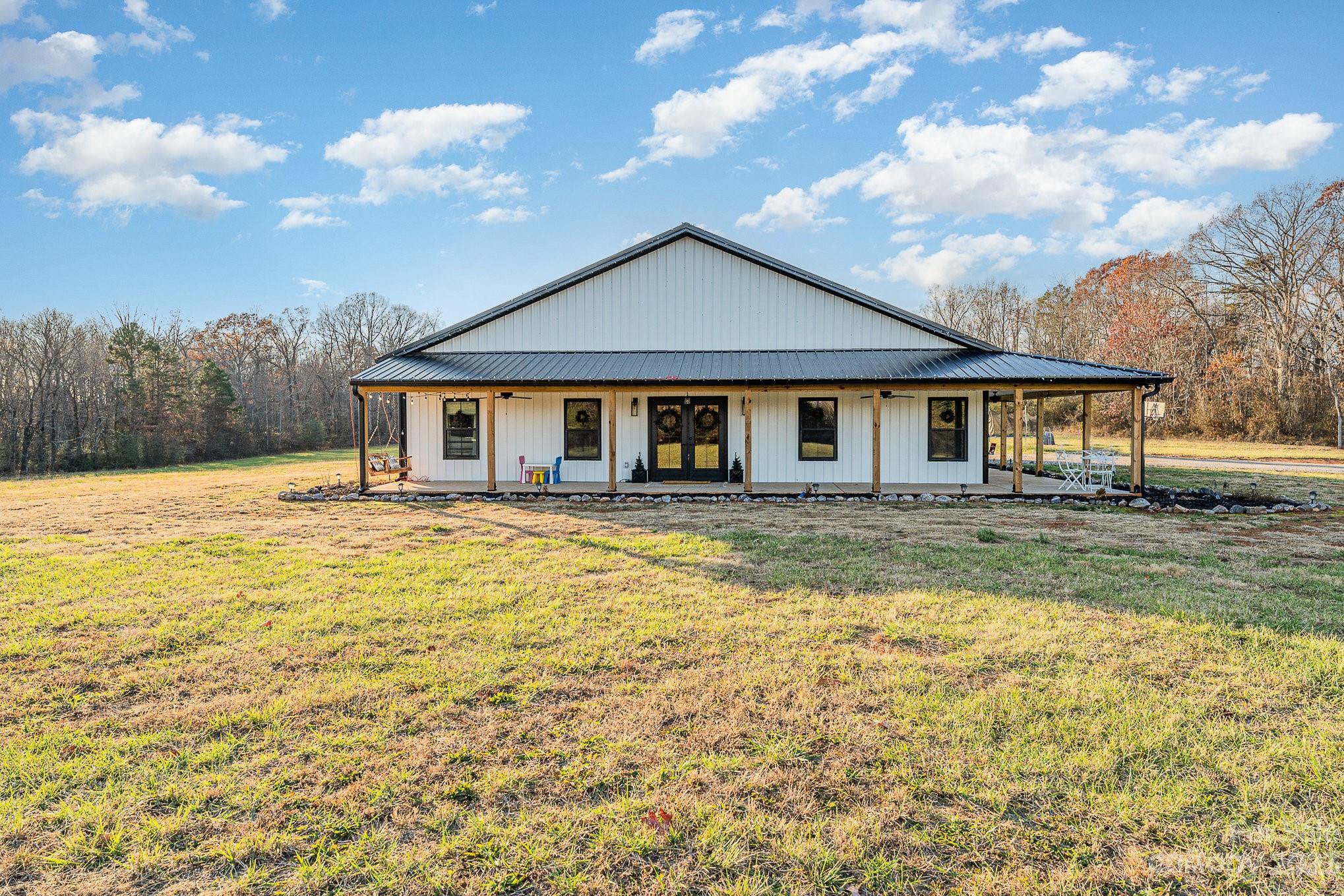 5261 Henderson Road Hamptonville, NC 27020 - Photo 10 of 46 a front view of a house with swimming pool