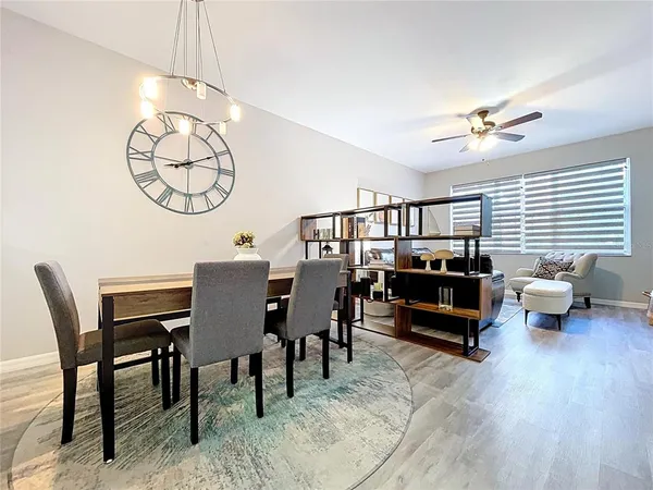 a view of a dining room with furniture and wooden floor