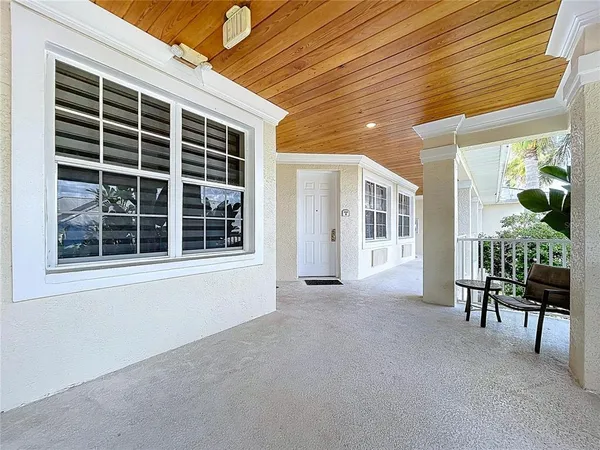 a view of a hallway with windows