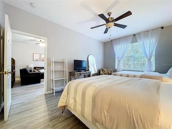 a bedroom with bed and window