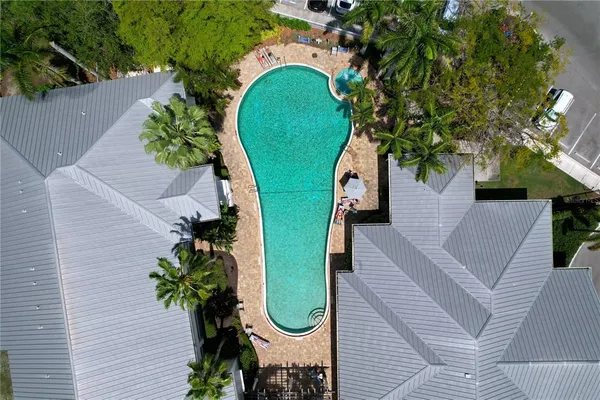 an aerial view of a house with a yard