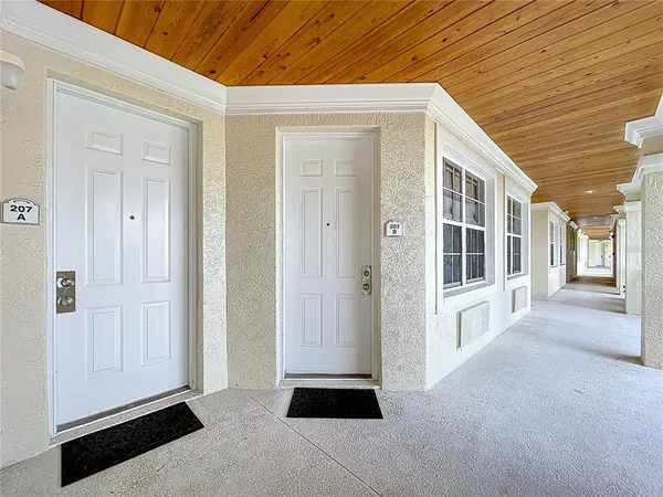 a kitchen with stainless steel appliances a refrigerator and a stove top oven