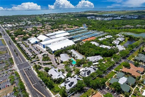 an aerial view of residential houses with outdoor space
