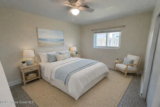 a bedroom with bed and a window