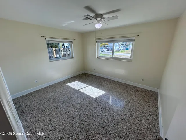 a view of empty room with windows