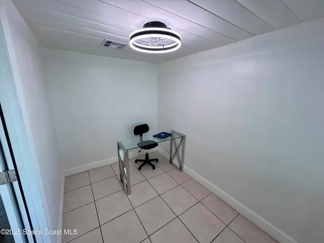 a view of a room with table and chair