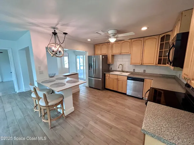 a kitchen with a table and chairs in it