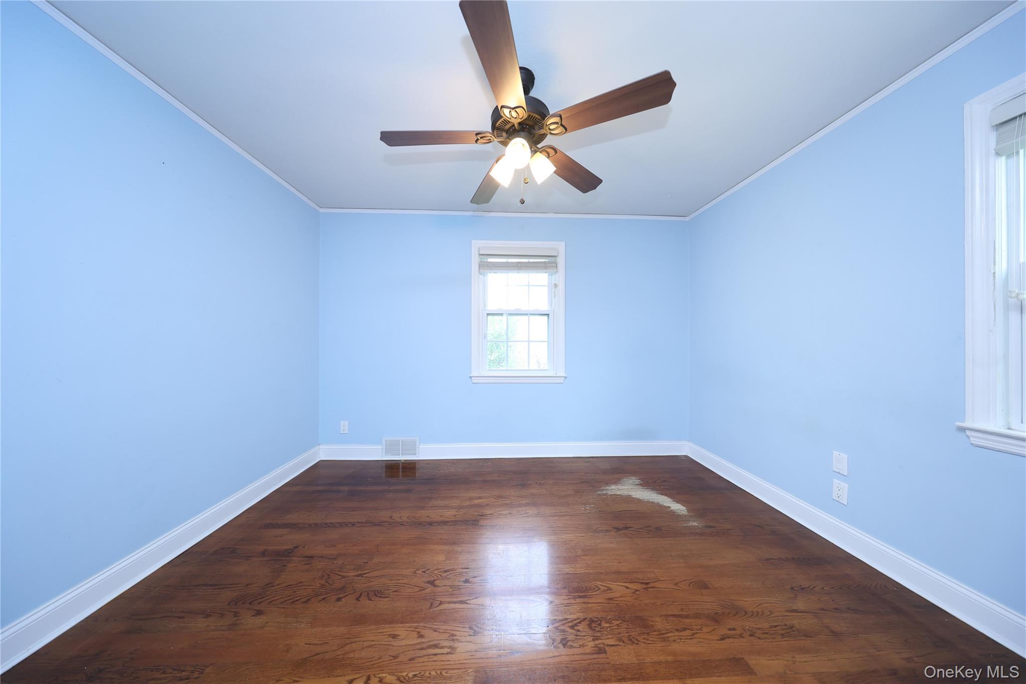 17 Pinewood Road Manhasset, NY 11030 - Photo 15 of 26 wooden floor in an empty room with a window