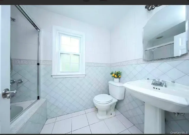 a bathroom with a sink toilet and bathtub