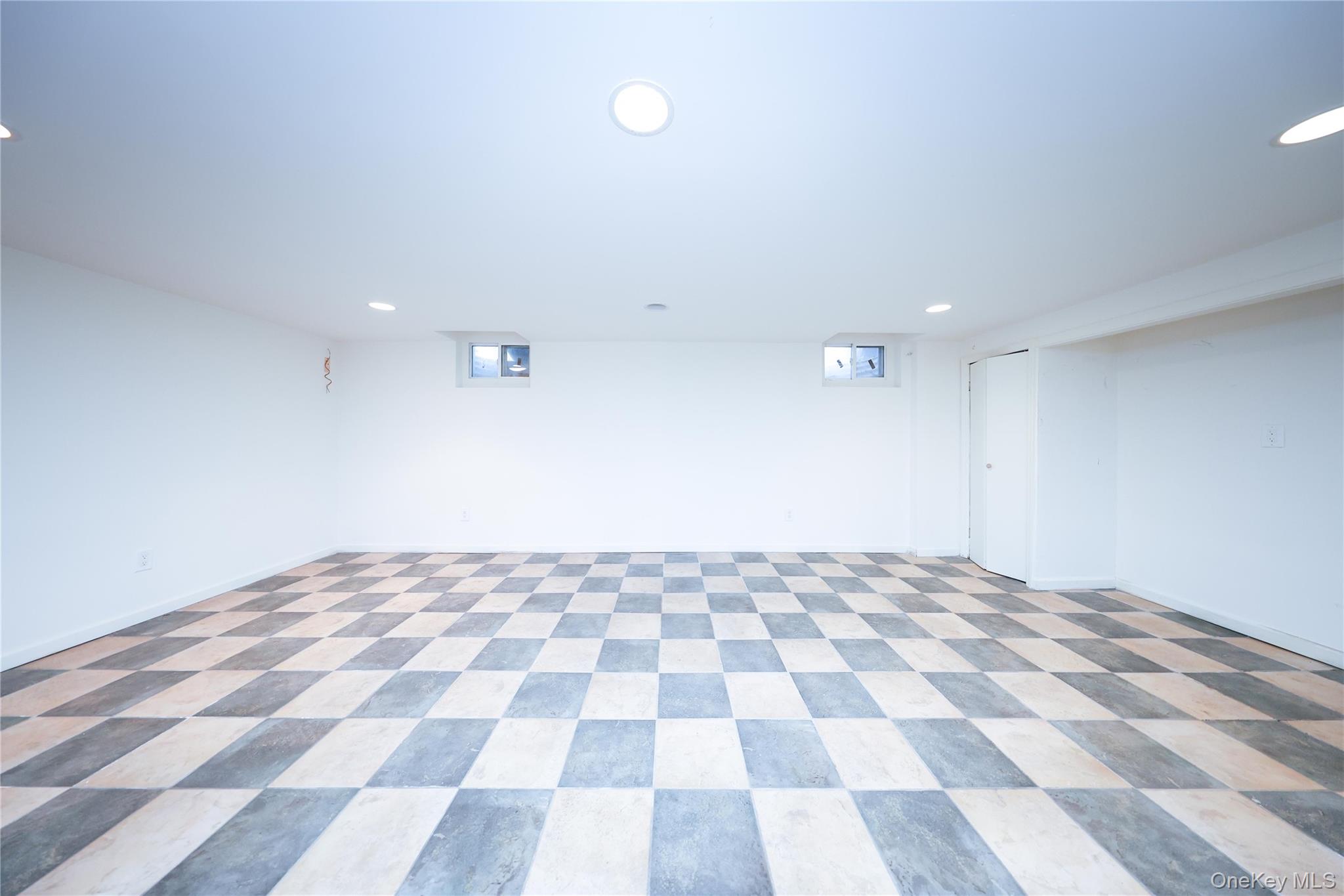 17 Pinewood Road Manhasset, NY 11030 - Photo 21 of 26 a view of a black and white checkered floor