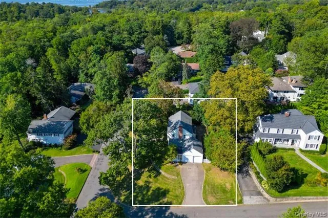 an aerial view of houses with yard