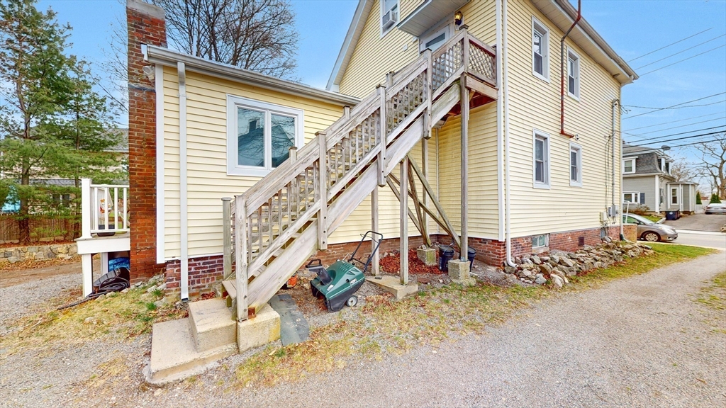 479 High Street Dedham, MA 02026 - Photo 18 of 22 a view of a house with backyard and sitting area