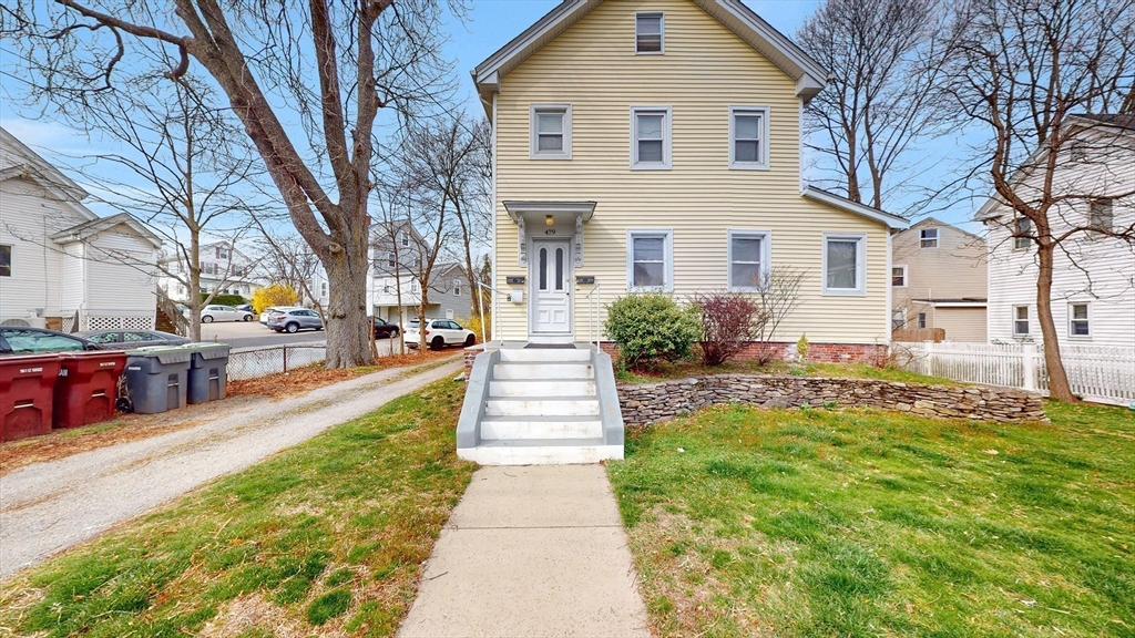 479 High Street Dedham, MA 02026 - Photo 21 of 22 a view of a house with a yard
