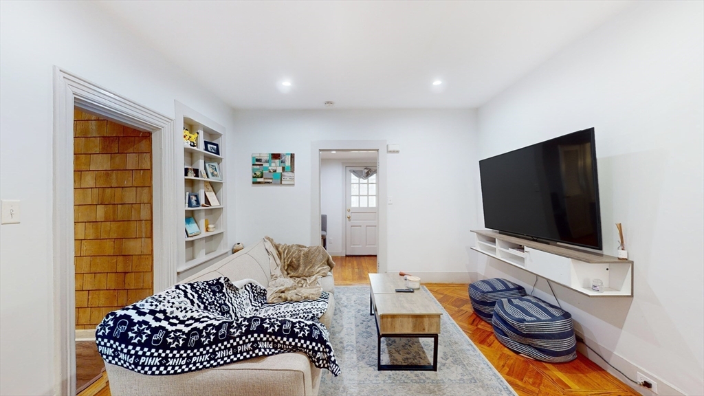 479 High Street Dedham, MA 02026 - Photo 3 of 22 a living room with furniture and a flat screen tv
