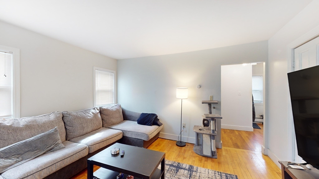 479 High Street Dedham, MA 02026 - Photo 9 of 22 a living room with furniture and a flat screen tv