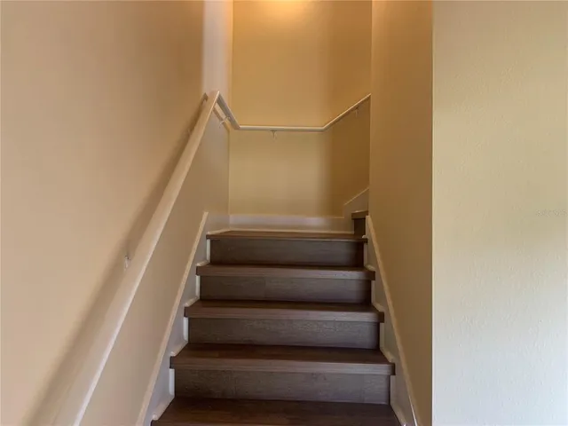 a view of staircase with white walls
