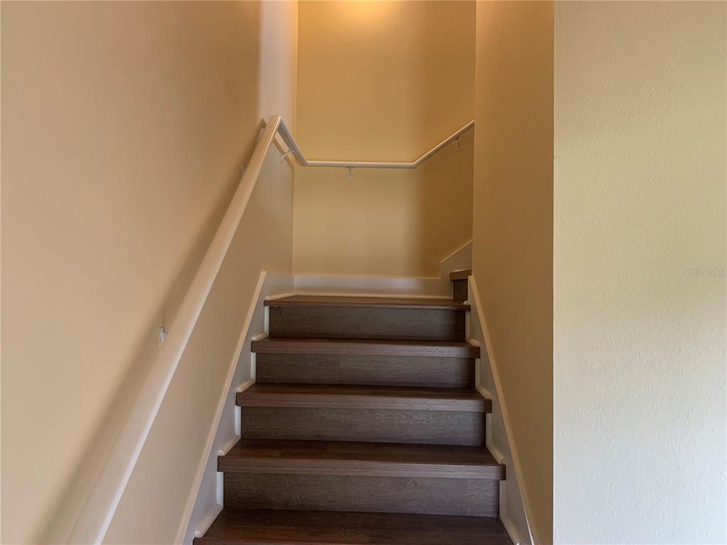 1555 Scarlet Oak Loop, Unit 113A Winter Garden, FL 34787 - Photo 8 of 11 a view of staircase with white walls