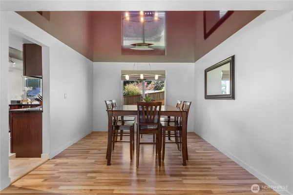 a kitchen with refrigerator and cabinets