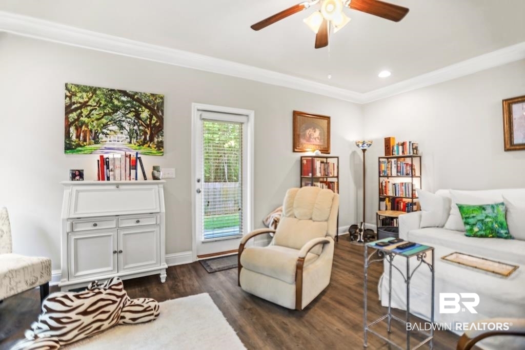 25806 Pollard Road, Unit 27 Daphne, AL 36526 - Photo 15 of 46 Living area featuring a ceiling fan, dark wood-style flooring, crown molding, and recessed lighting