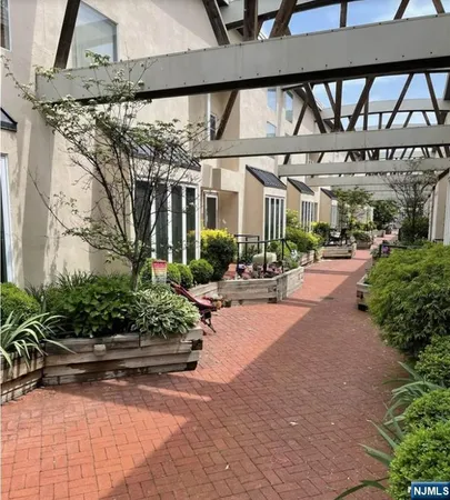 a building with potted plants in front of it