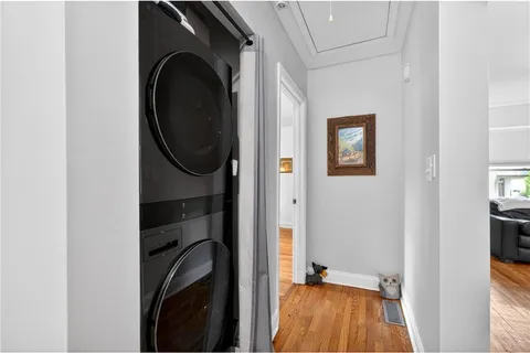 a view of a bedroom with washer and dryer