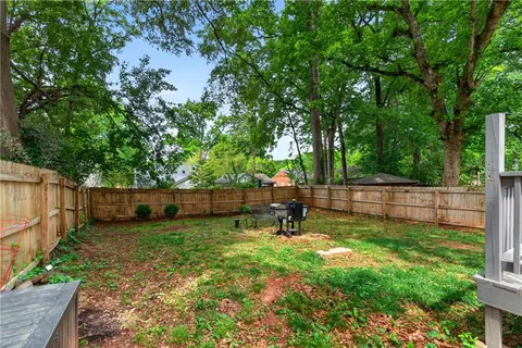 a view of a backyard with a swing