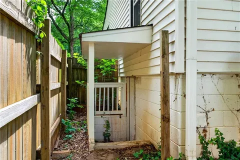 a view of a house with a door and wooden floor