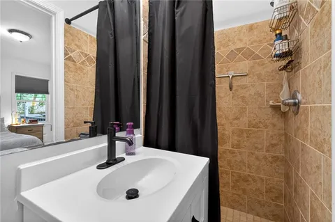 a bathroom with a sink and a large mirror