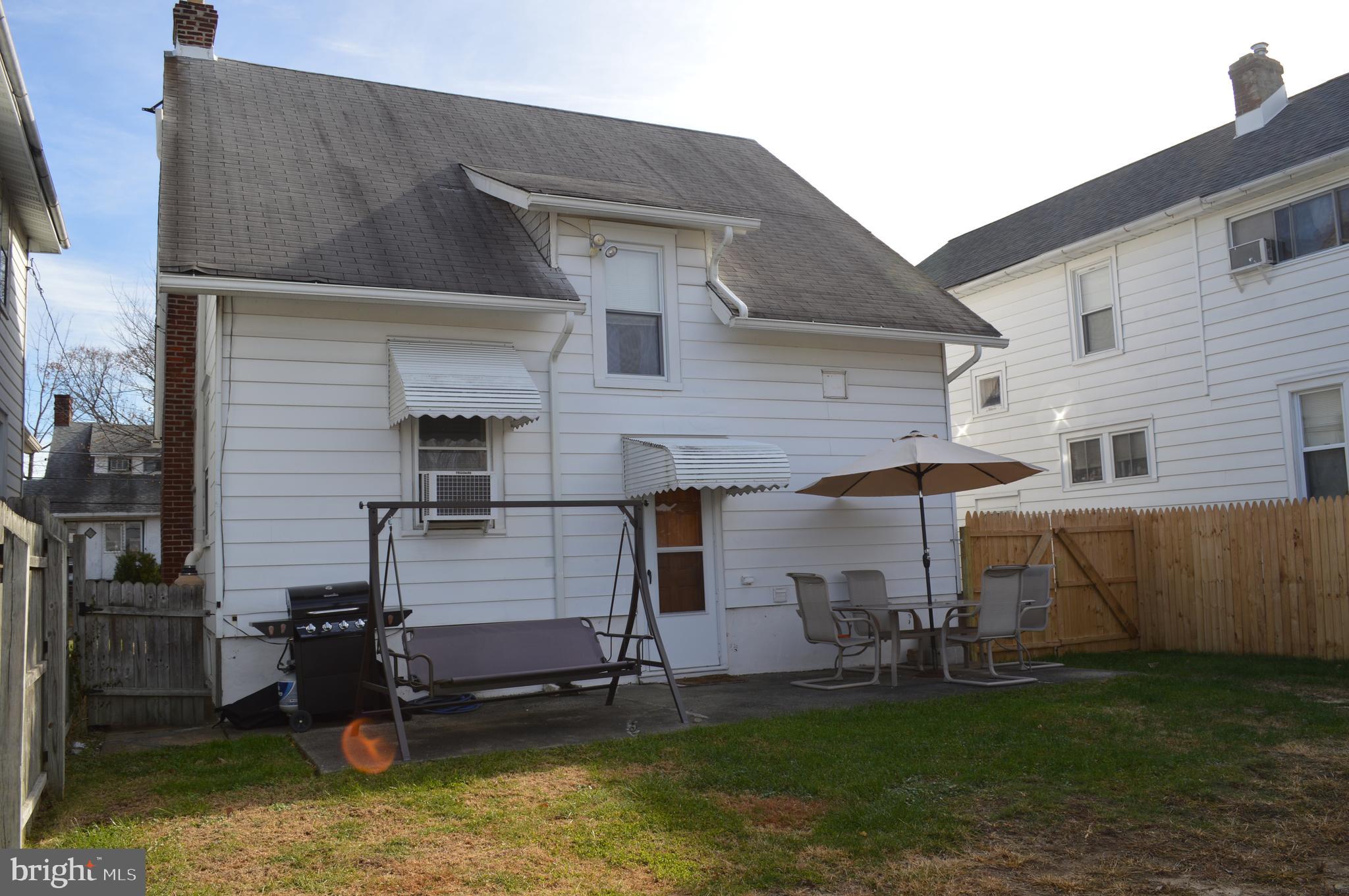 BBQ & patio across rear of house