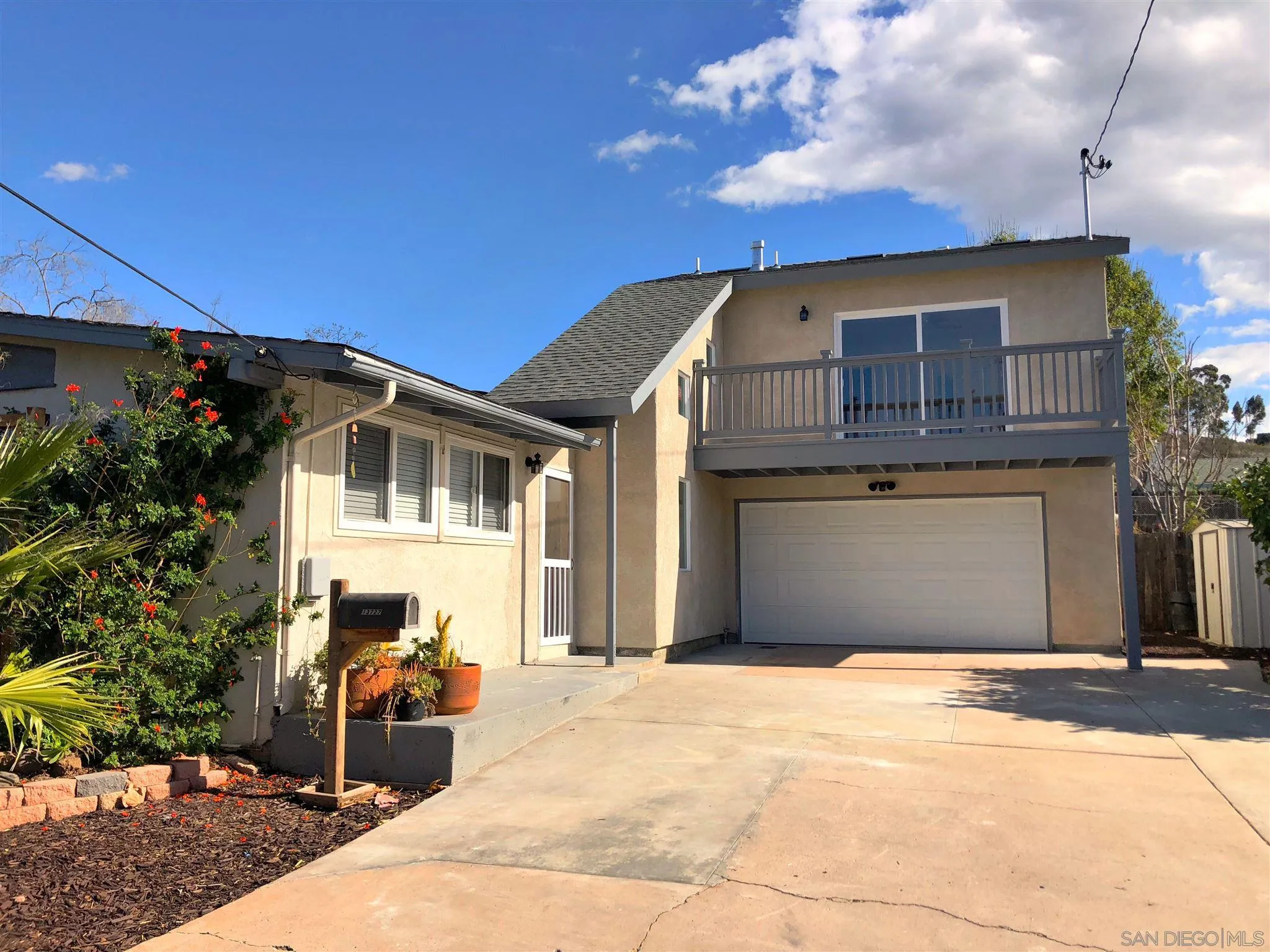 13727 Powers Road Poway, CA 92064 - Photo 1 of 4 a front view of a house with a yard
