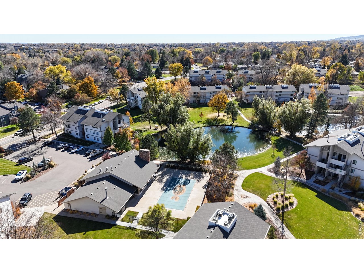 1705 Heatheridge Road, Unit G302 Fort Collins, CO 80526 - Photo 27 of 31 an aerial view of a swimming pool and lake view