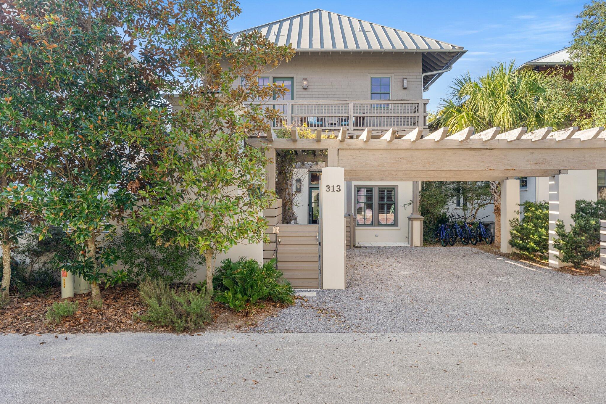 313 East Water Street Inlet Beach, FL 32461 - Photo 48 of 56 a front view of a house with garden