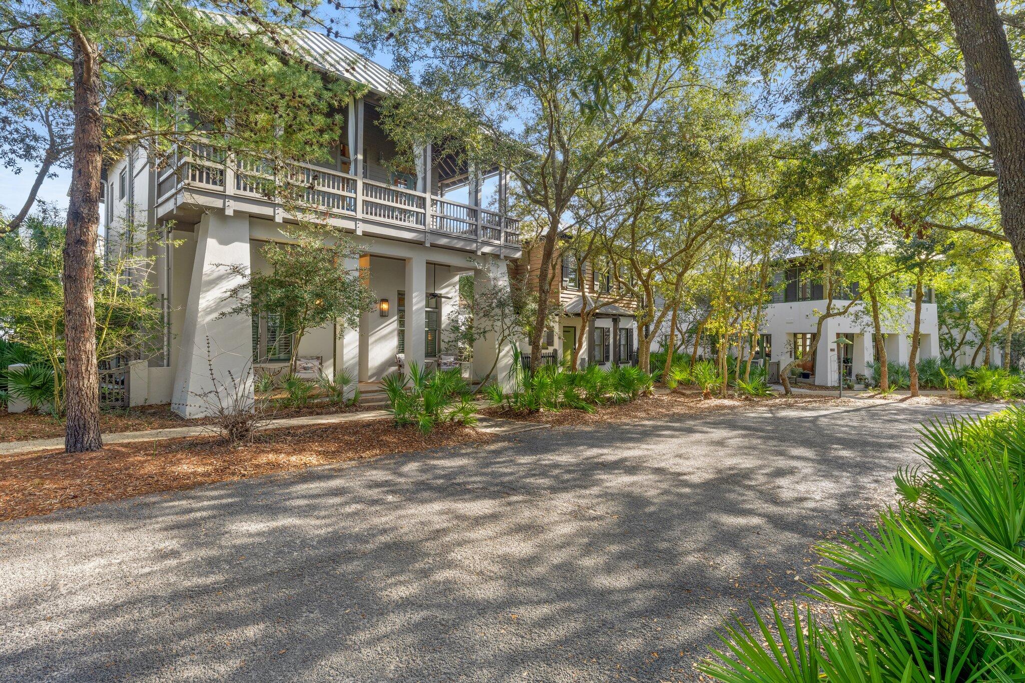 313 East Water Street Inlet Beach, FL 32461 - Photo 50 of 56 a view of a house with a yard and tree s