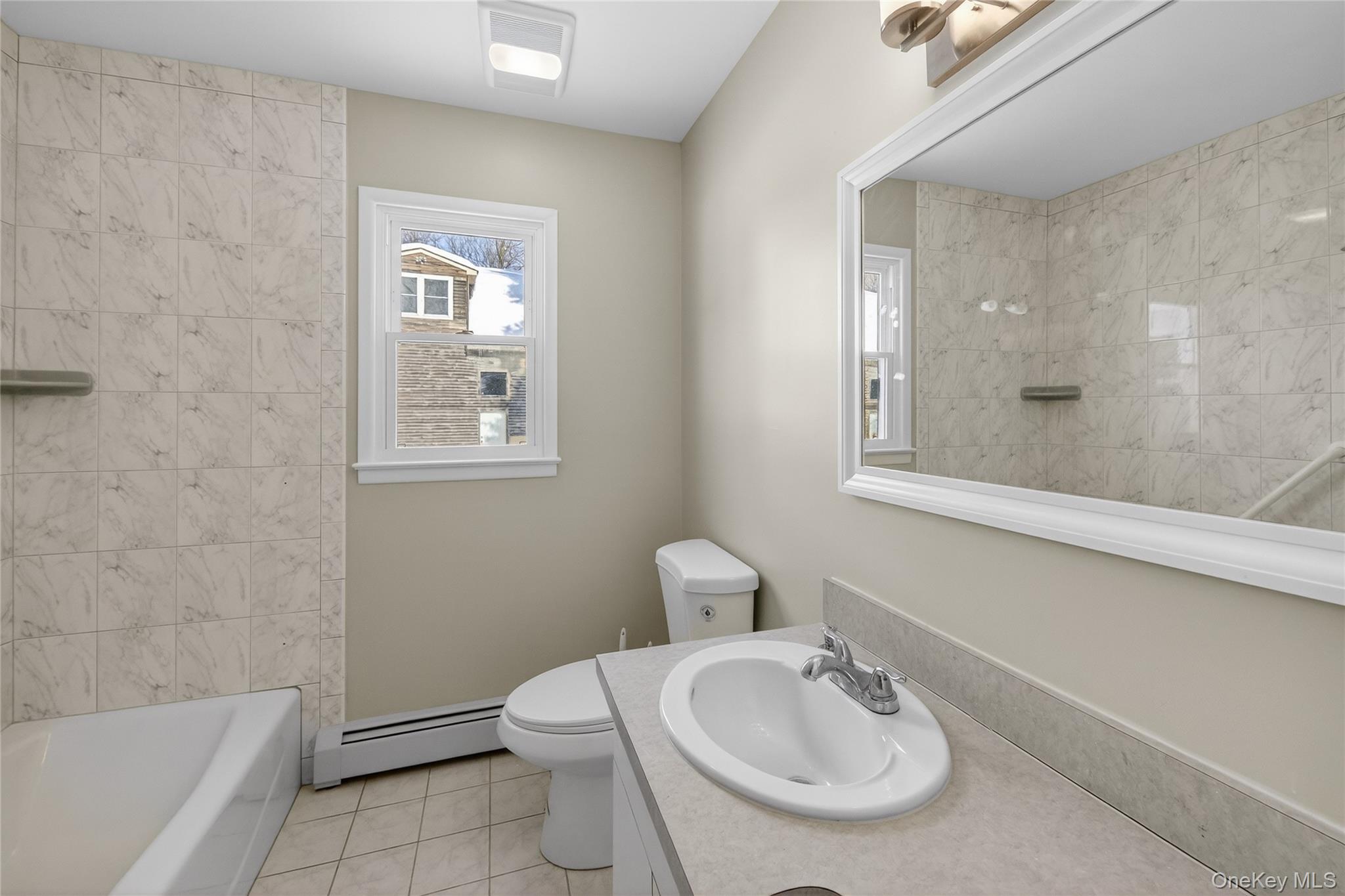 676-678 Oak Summit Road Millbrook, NY 12545 - Photo 11 of 22 a bathroom with a sink a toilet and shower