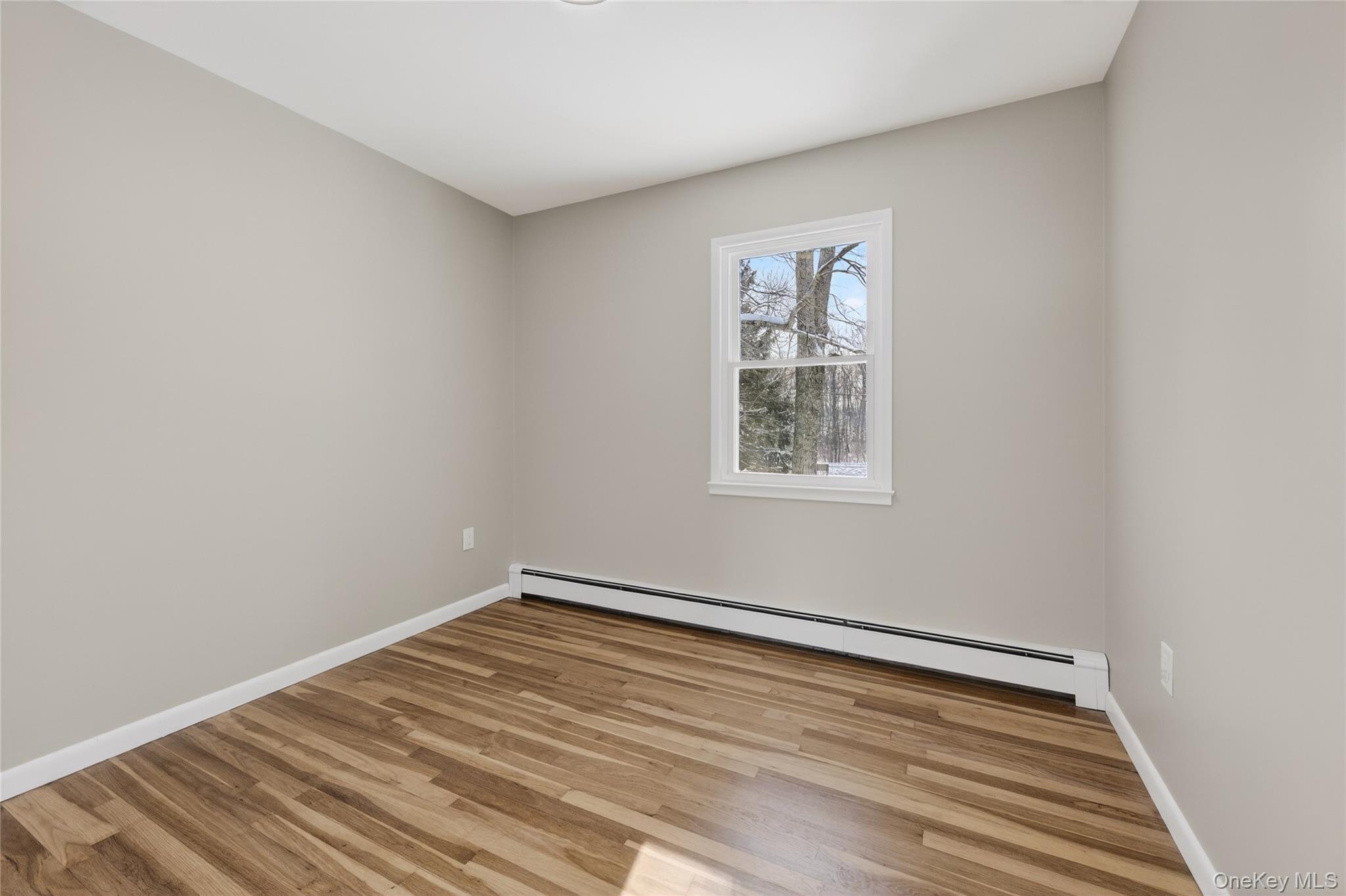 676-678 Oak Summit Road Millbrook, NY 12545 - Photo 15 of 22 a view of a room with wooden floor and window