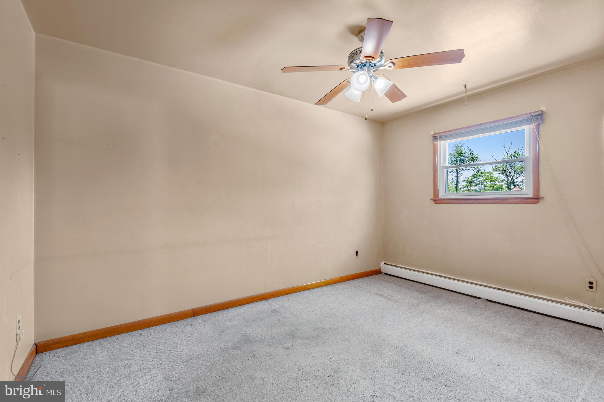 1013 Orems Road Baltimore, MD 21220 - Photo 20 of 37 an empty room with chandelier fan and window