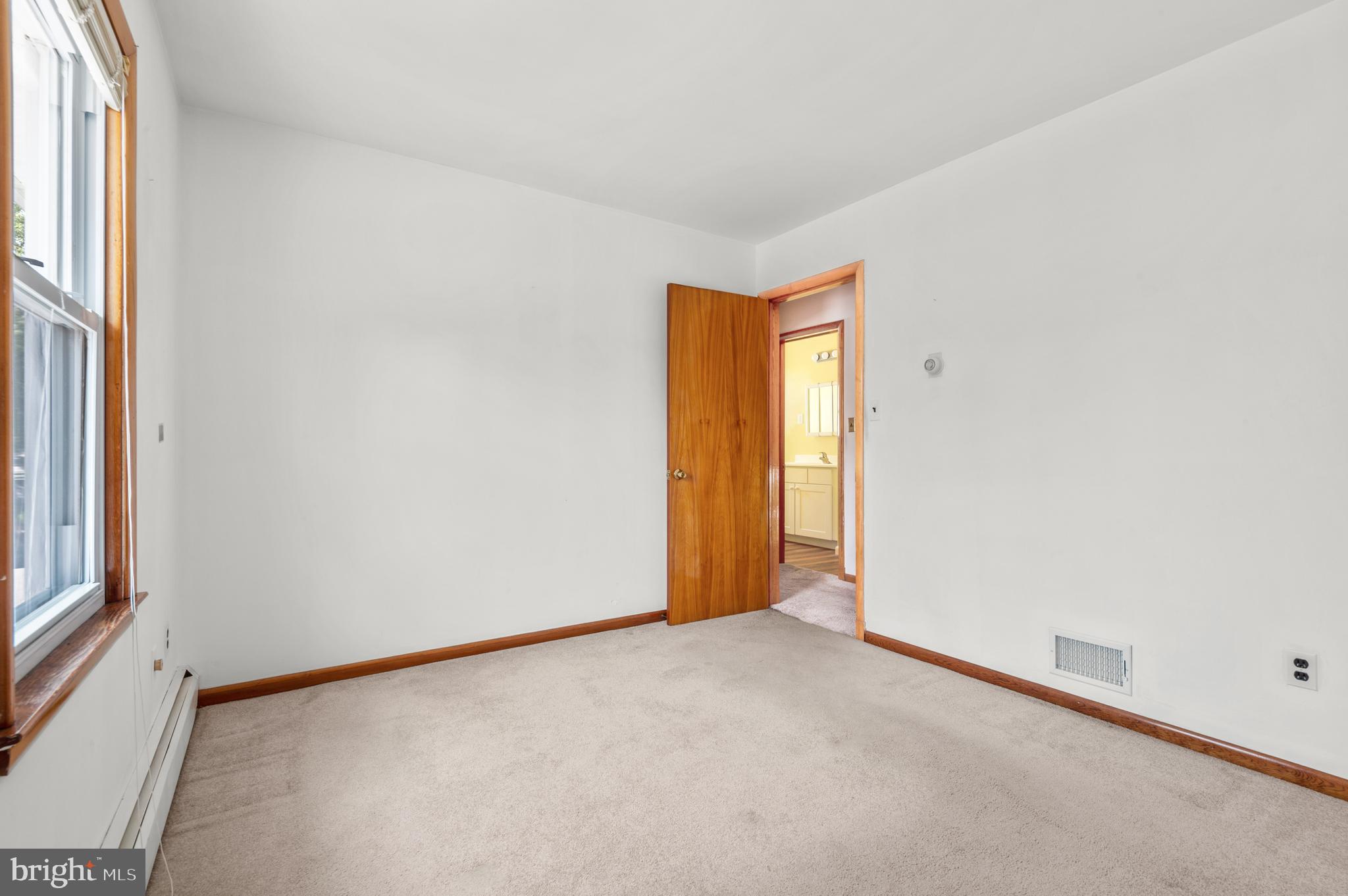 1013 Orems Road Baltimore, MD 21220 - Photo 22 of 37 a view of an empty room and a window
