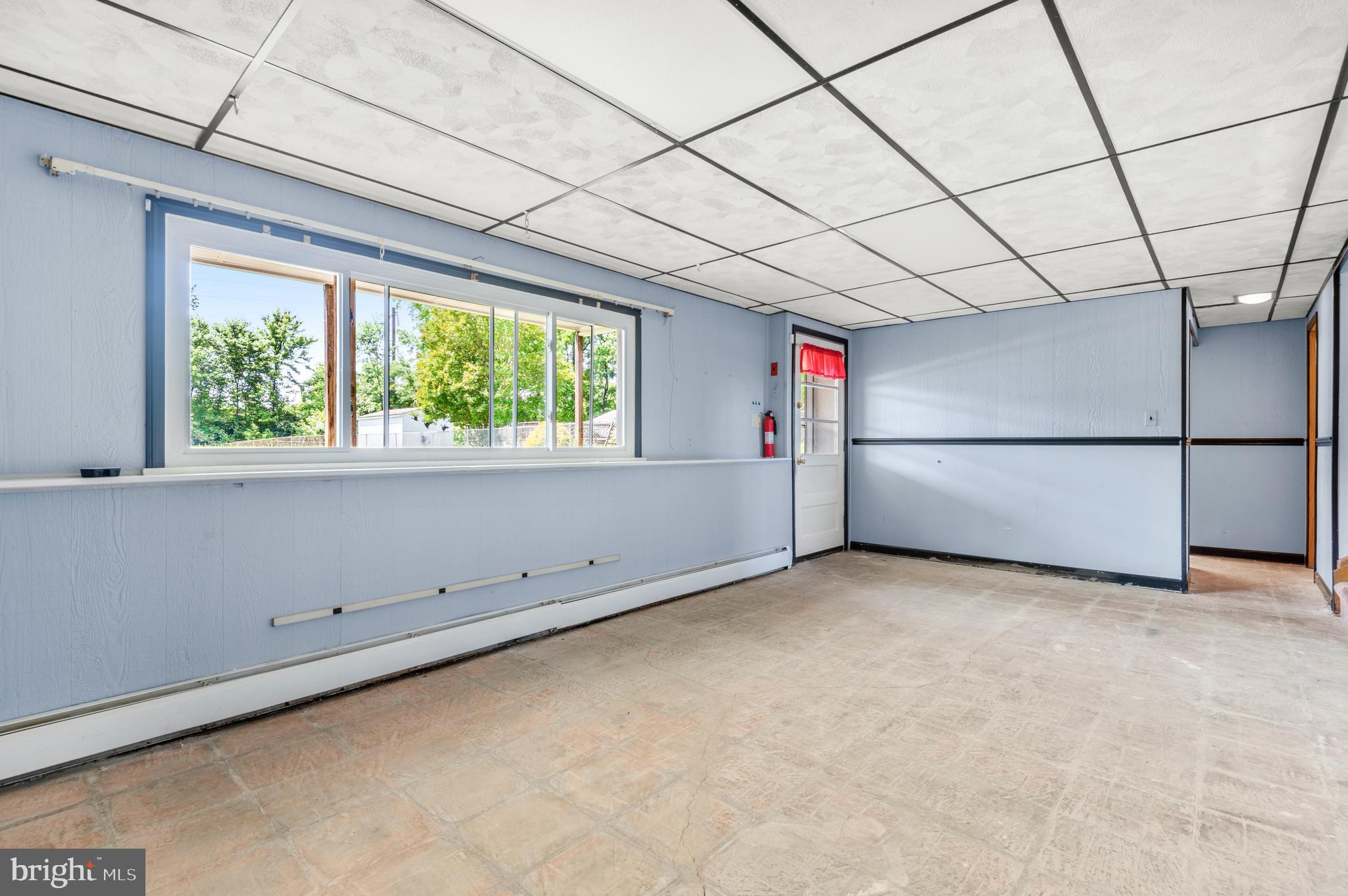 1013 Orems Road Baltimore, MD 21220 - Photo 25 of 37 a view of empty room with cabinet and windows