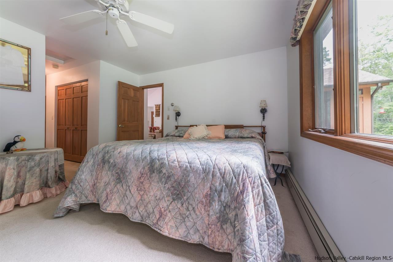 366 Buck Road Stone Ridge, NY 12484 - Photo 15 of 26 a bedroom with a bed and window