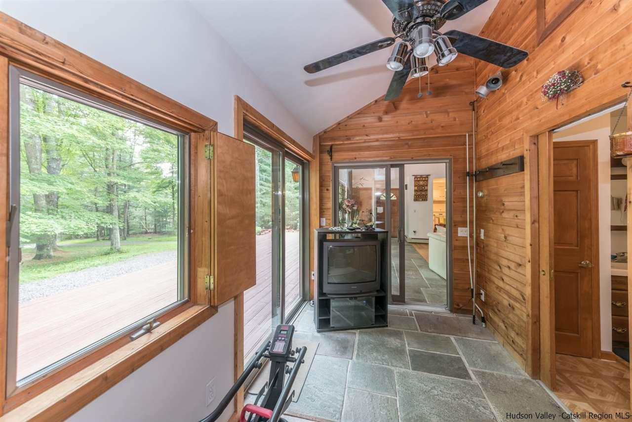 366 Buck Road Stone Ridge, NY 12484 - Photo 17 of 26 a view of a hallway with a glass door and an entryway