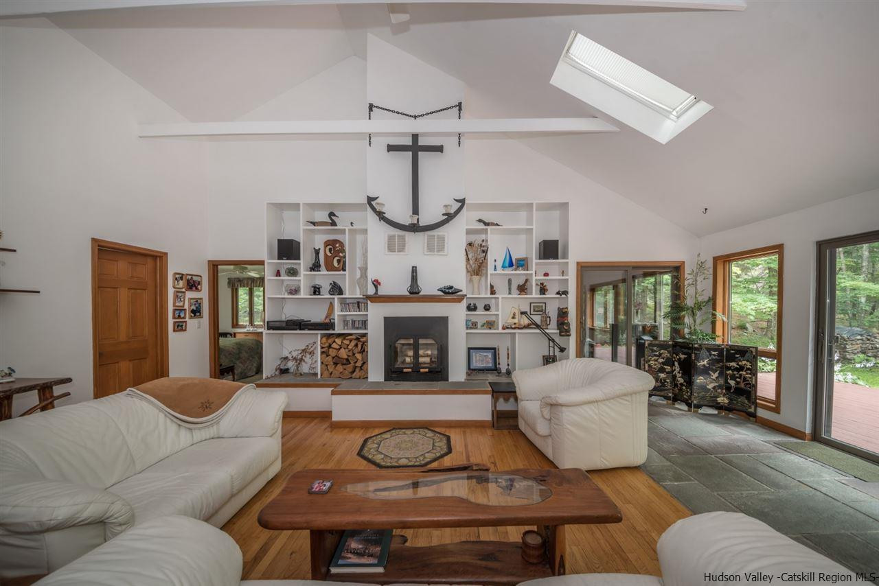 366 Buck Road Stone Ridge, NY 12484 - Photo 5 of 26 a living room with furniture a rug and white walls