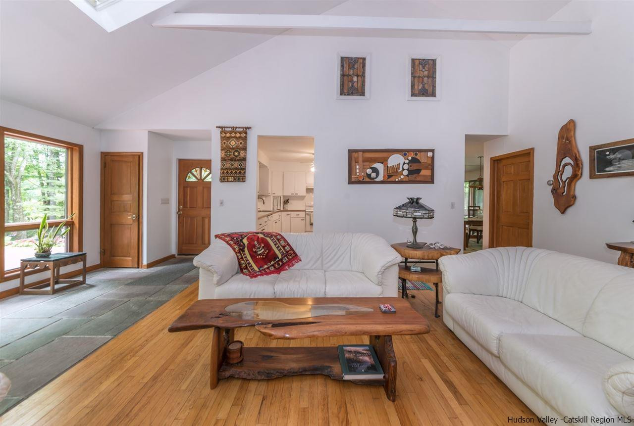 366 Buck Road Stone Ridge, NY 12484 - Photo 8 of 26 a living room with furniture and a flat screen tv