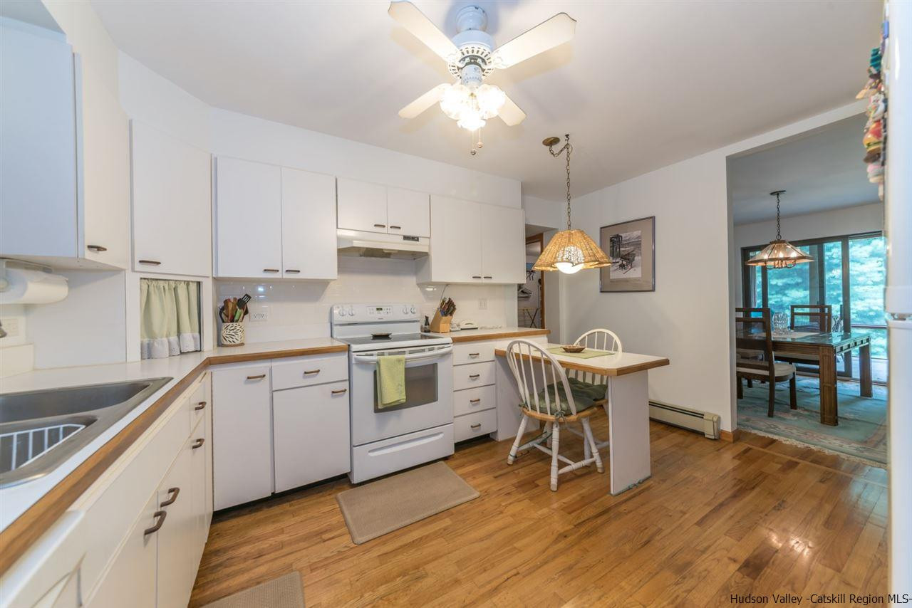 366 Buck Road Stone Ridge, NY 12484 - Photo 10 of 26 a kitchen with a sink cabinets and window