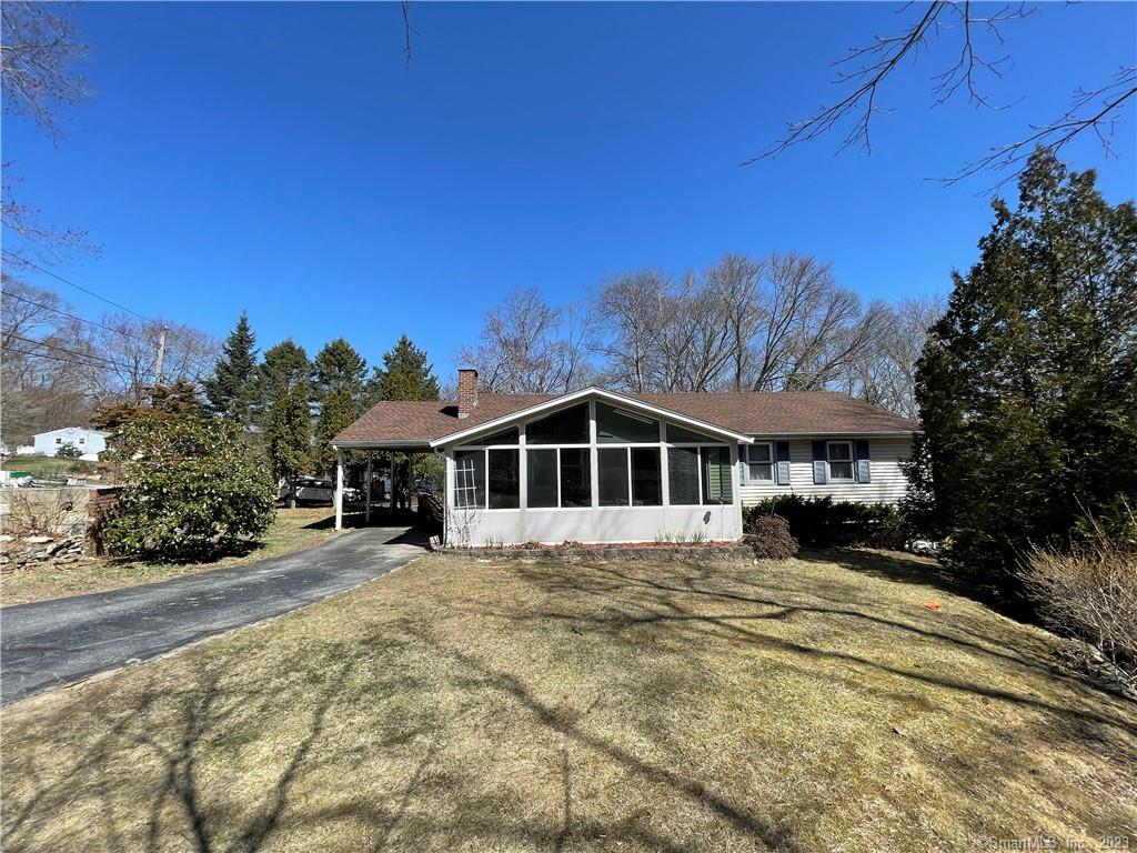 4 Hillside Drive Gales Ferry, CT 06335 - Photo 1 of 1 a front view of a house with a yard