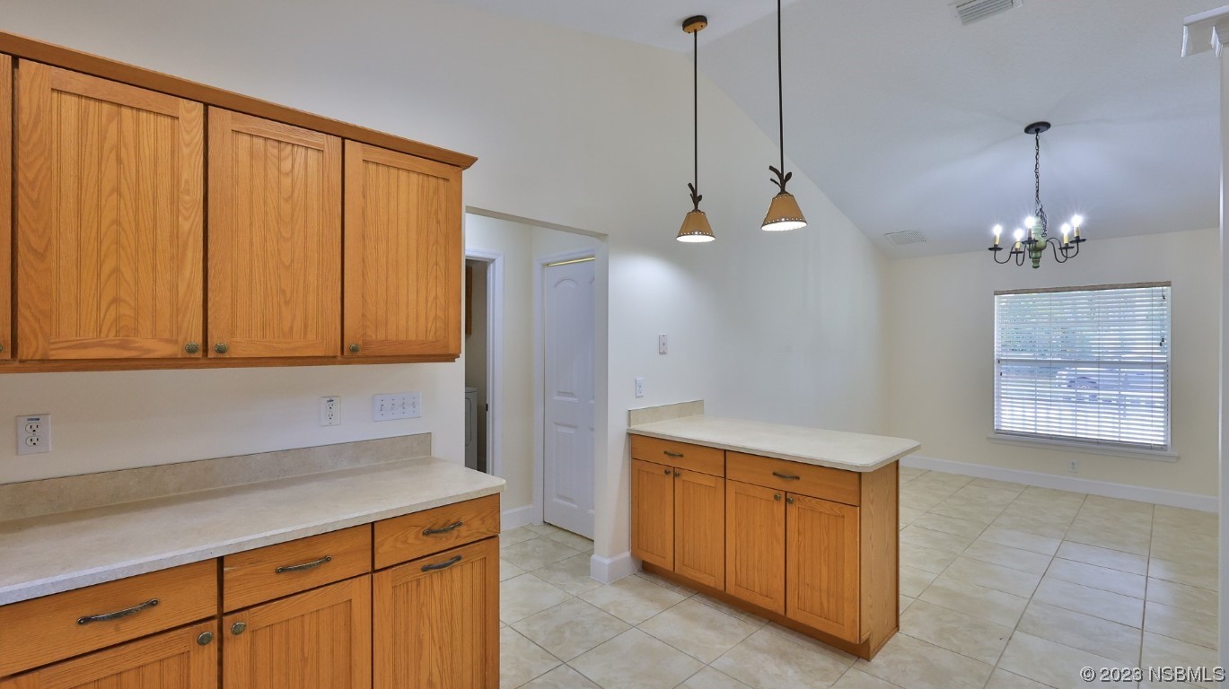 2655 Flowing Well Road DeLand, FL 32720 - Photo 16 of 23 a kitchen that has a lot of cabinets in it