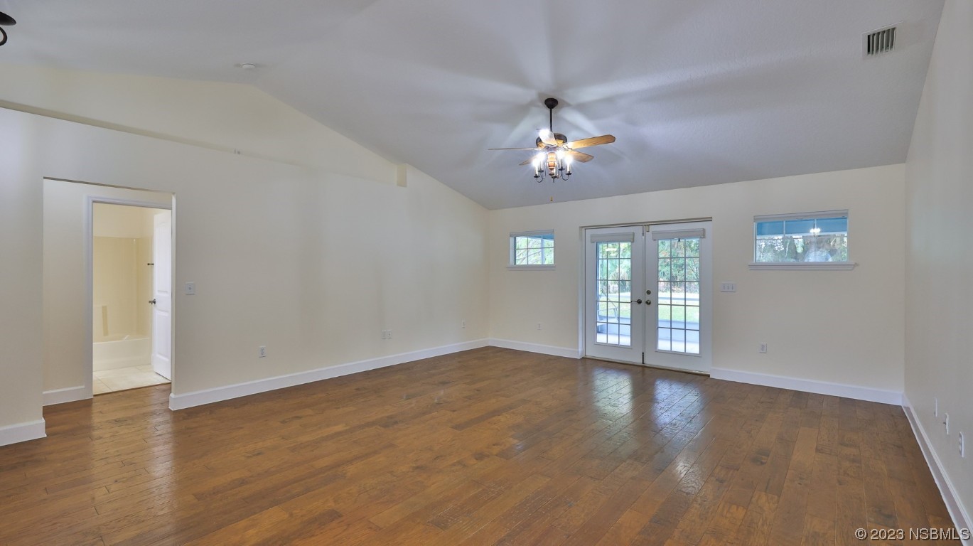 2655 Flowing Well Road DeLand, FL 32720 - Photo 17 of 23 a view of empty room with wooden floor and fan