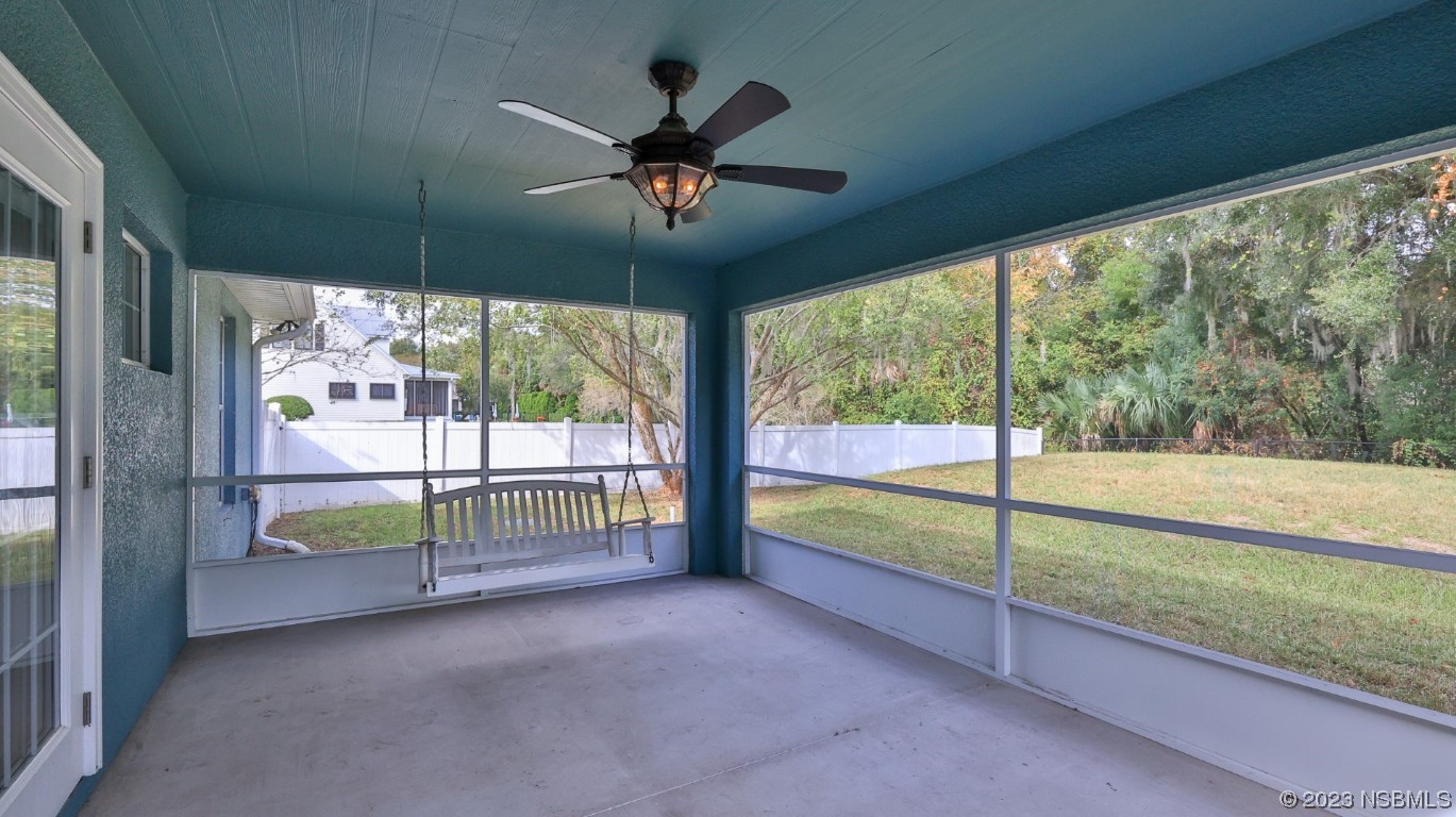 2655 Flowing Well Road DeLand, FL 32720 - Photo 6 of 23 an empty room with sliding door