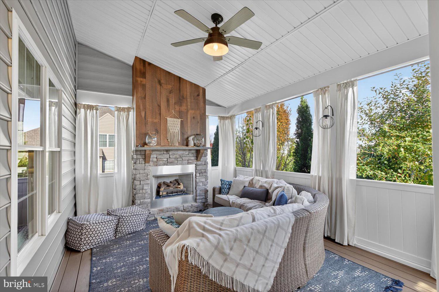 311 Ecker Drive Lititz, PA 17543 - Photo 14 of 49 a living room with furniture fireplace and large windows
