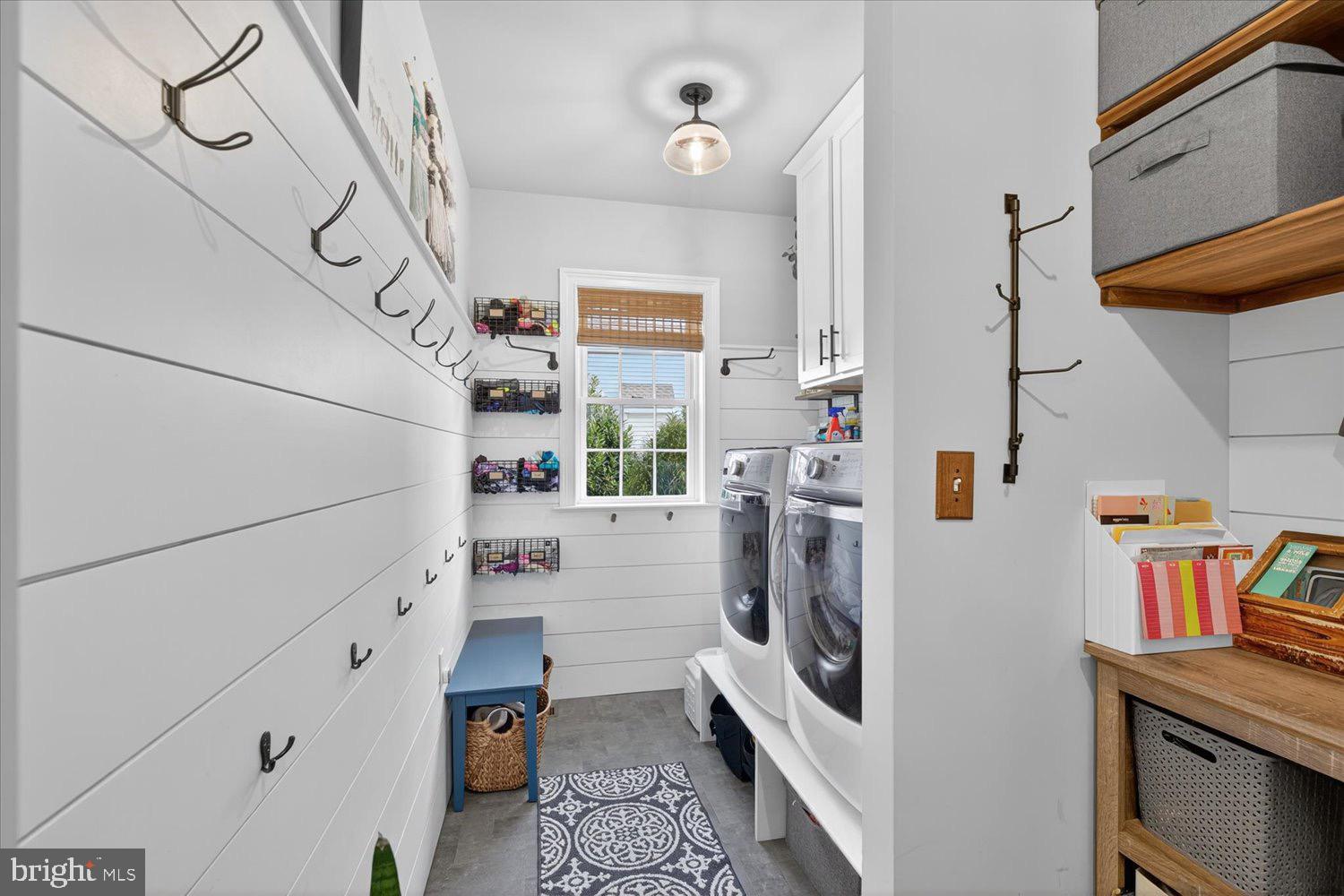 311 Ecker Drive Lititz, PA 17543 - Photo 19 of 49 a utility room with fridge and wooden floor